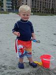 Kayden playing in the sand